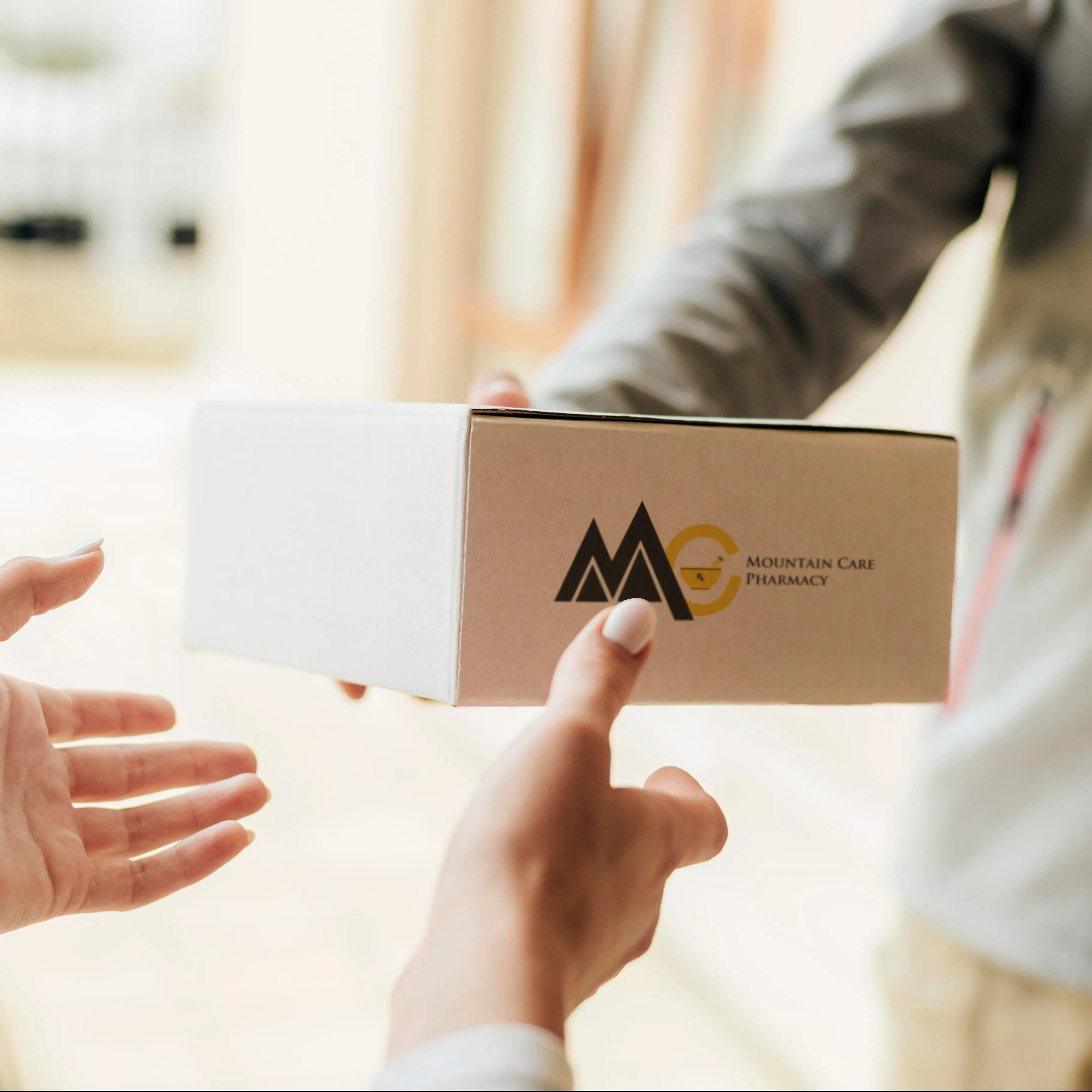 Delivery driver handing package to woman