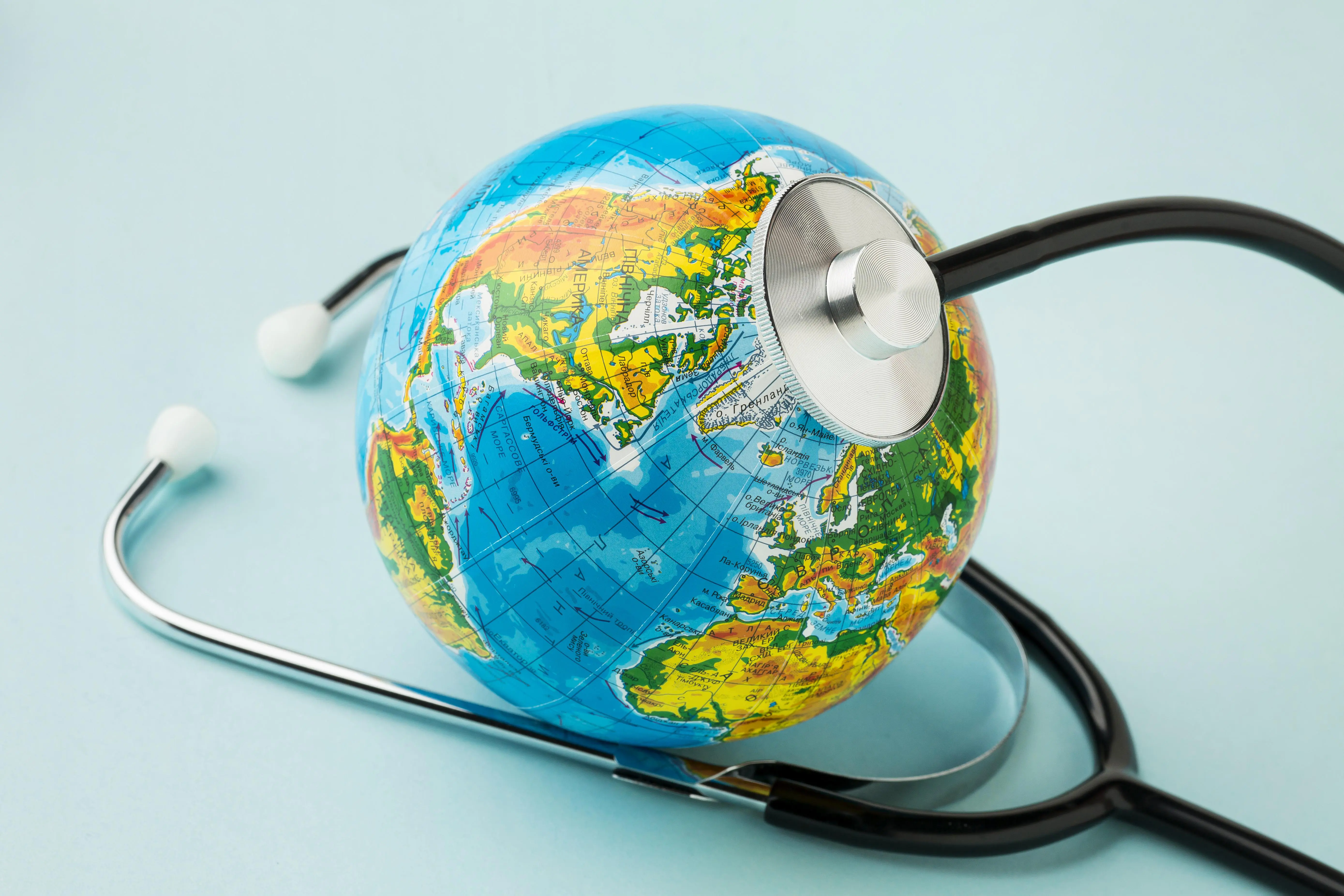 high-angle-globe-with-stethoscope-peace-day (1)