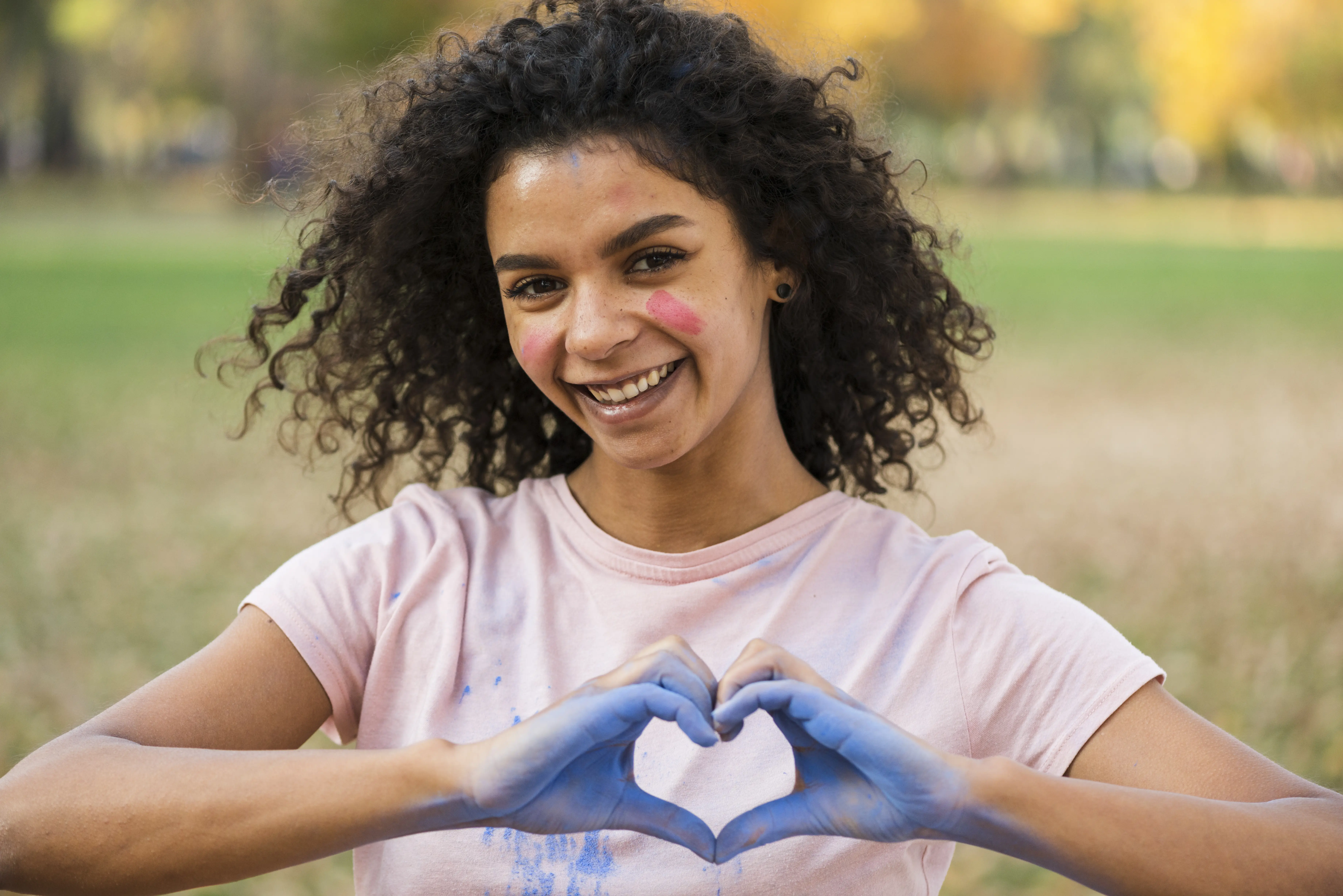 woman-making-love-sign-with-hands